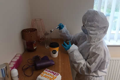 A forensic science student in Keele's commercial scenario crime scene facility.