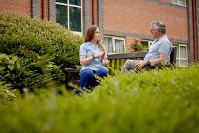  A nursing student talking to a patient.