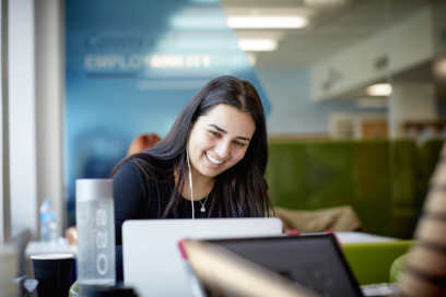 A female student using a laptop