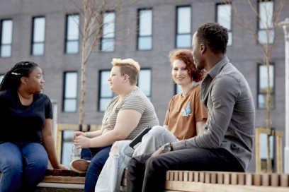 A group of students seated outside Keele Business School