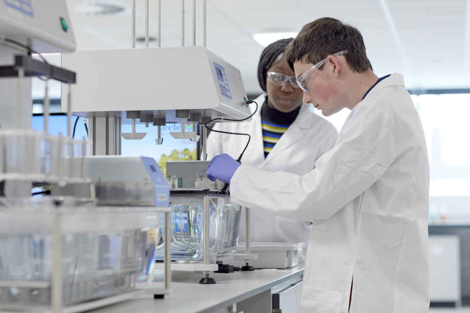 Male and female students wearing PPE and using specialist equipment in Keele's Central Science Labs
