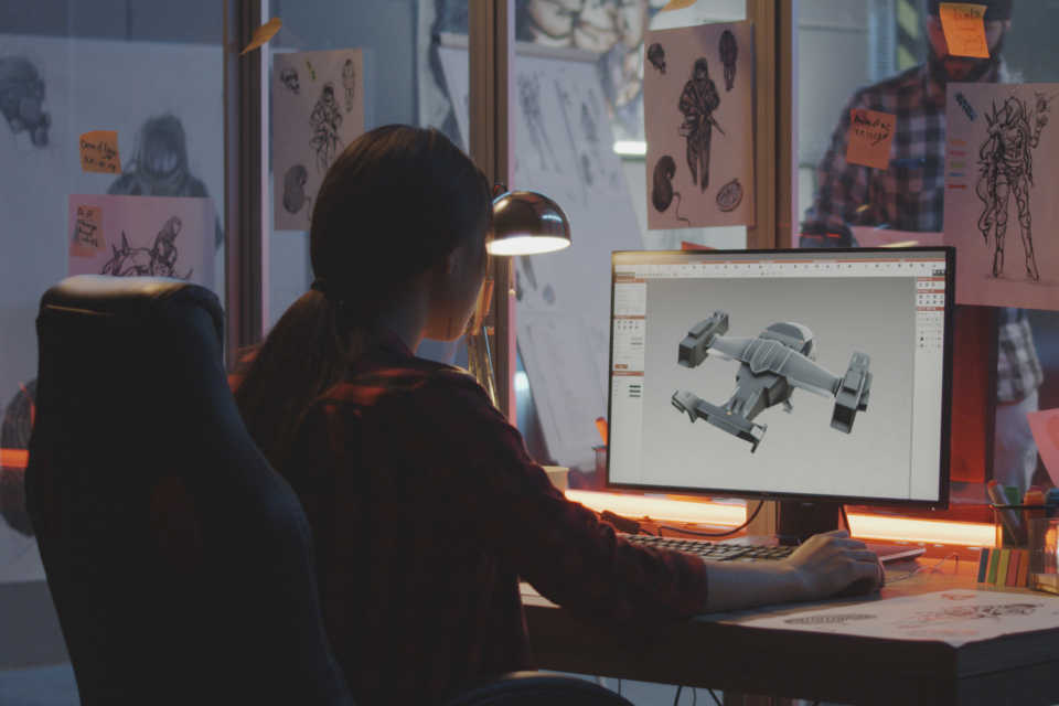 A keele university game design student working at a computer