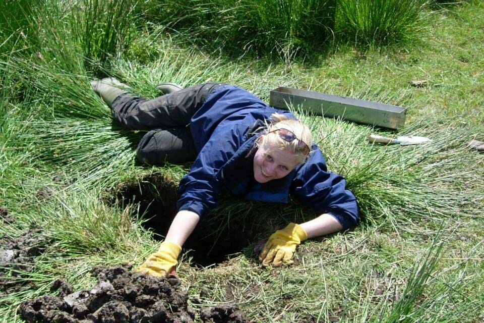student digging hole 