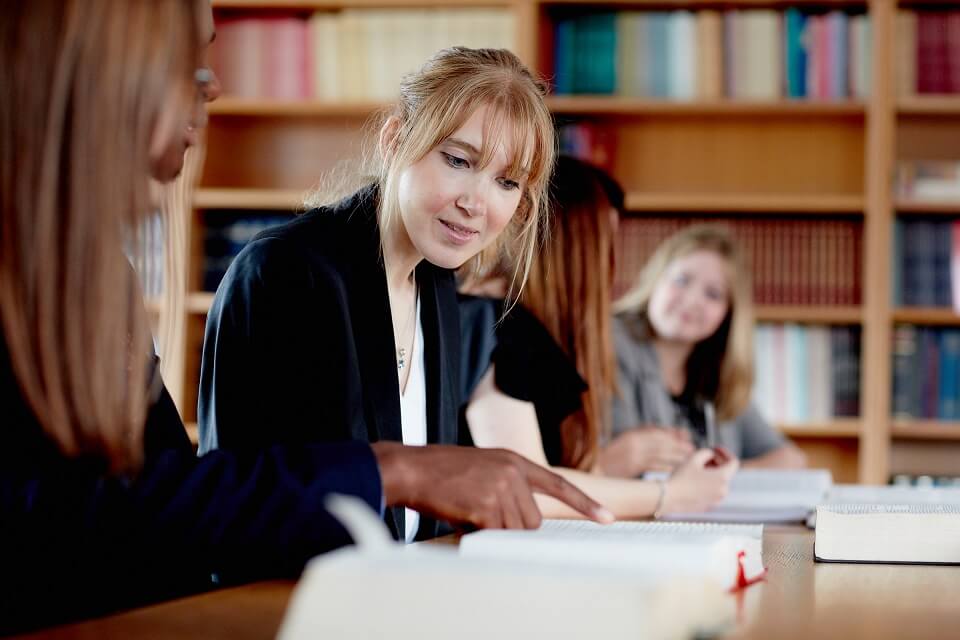 Keele Law with Politics students looking at publications in library