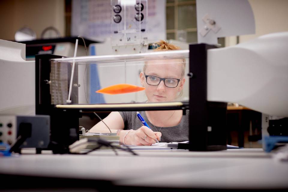 students looking at equipment