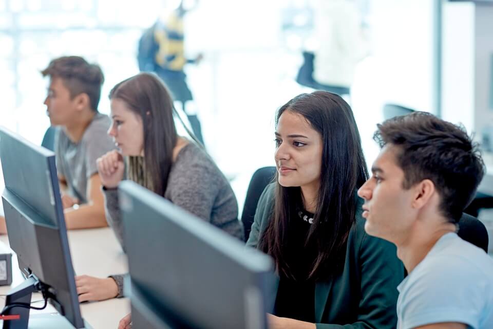 Students sitting in front of computers