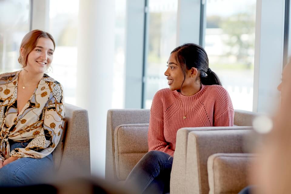 Students sitting in social space
