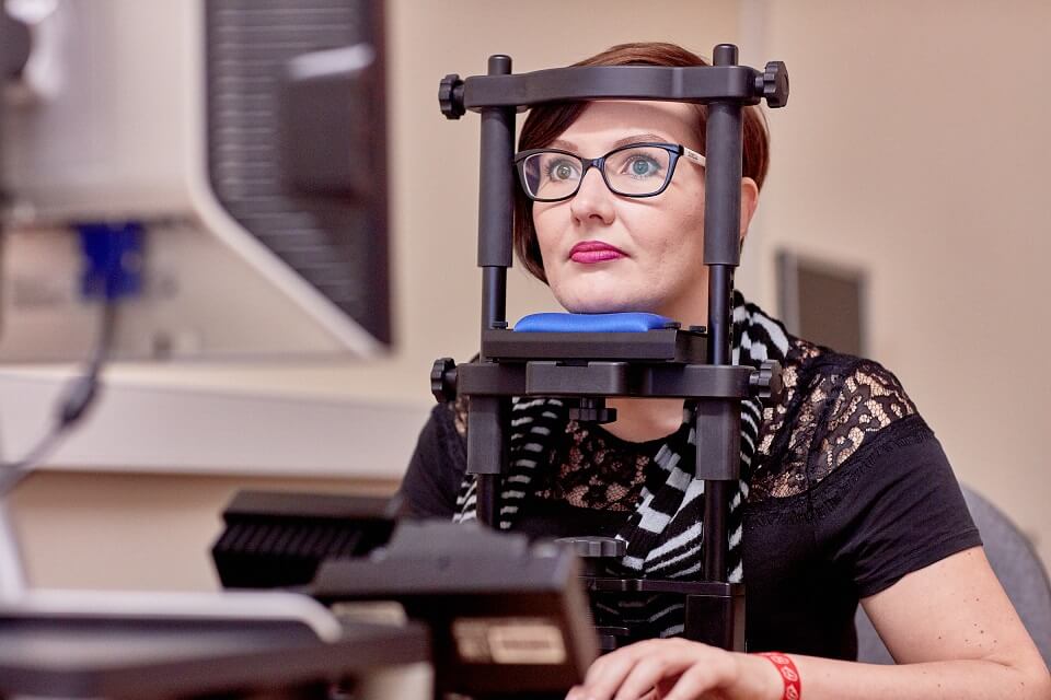 Keele psychology with placement year student using eye tracking equipment in Keele lab