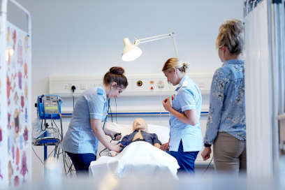 Student nurses undertaking a practical activity as part of their studies. 