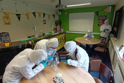 Forensic science students in Keele's commercial scenario crime scene facility.