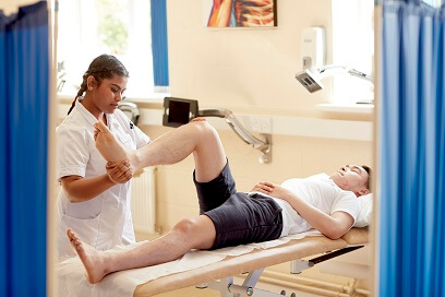 Physiotherapy student providing treatment