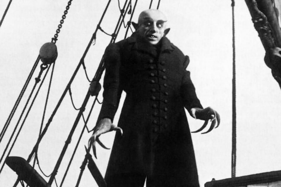 image from silent film Nosferatu of Dracula on a boat