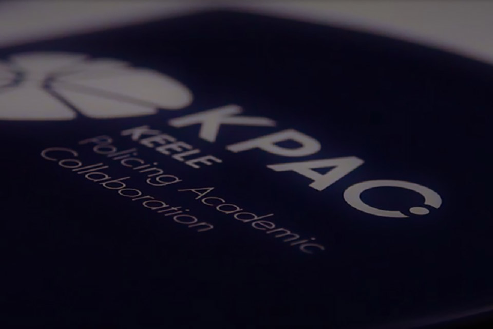 A close-up image of a folder, which has KPAC printed on the front.