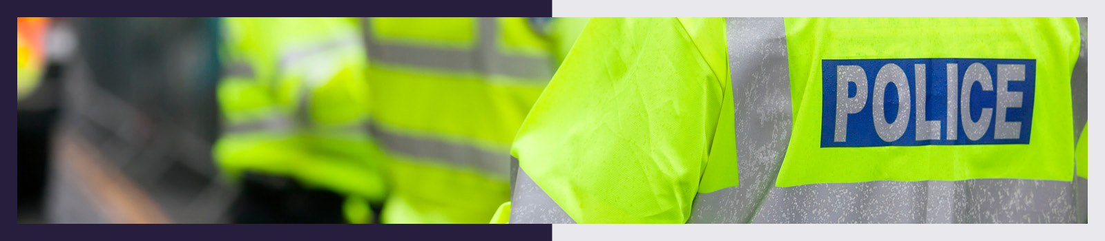 Reverse of hi vis jacket with text reading 'Police'